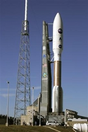 The Atlas V rocket that will carry the New Horizons spacecraft to Pluto sits on the launch pad at the Kennedy Space Center in Cape Canaveral, Fla., Monday, Jan. 16, 2006. The spacecraft is set to launch Tuesday and will take 9 to 14 years to reach Pluto. It is powered by 24 pounds of plutonium. (AP Photo/John Raoux) 